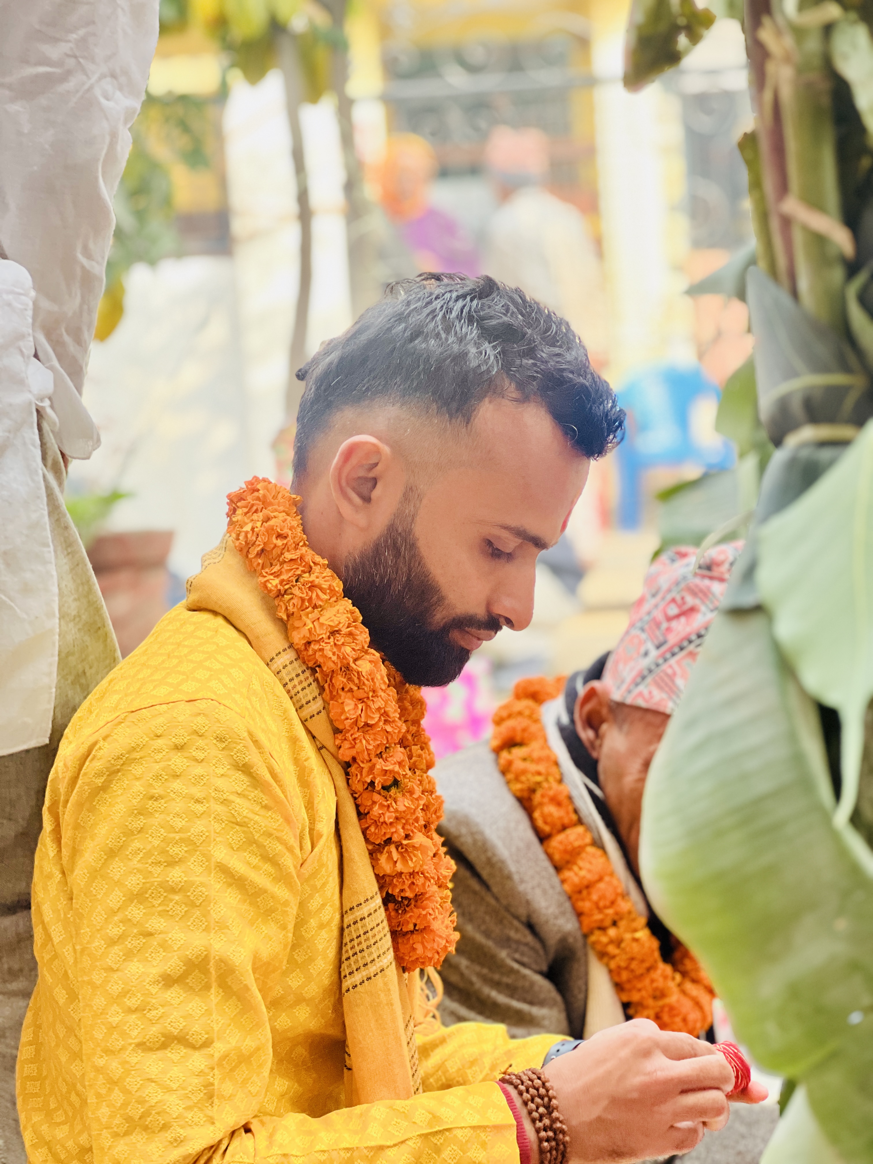 Gobinda Ghimire at a ceremony with marigold mala